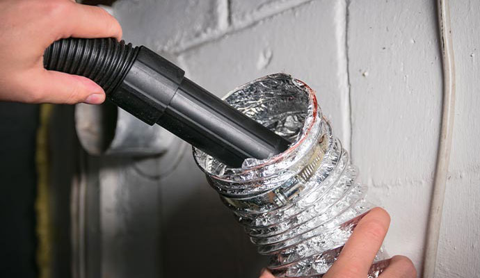 Expert worker cleaning duct pipe