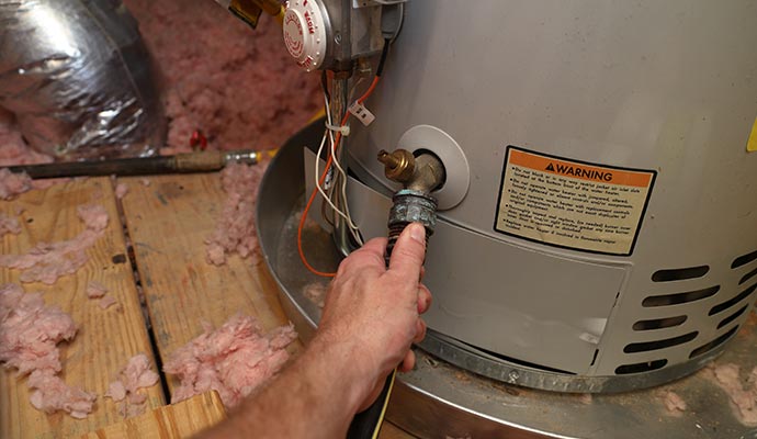 Worker repairing heater