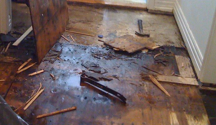 Wood floor severely damaged by water